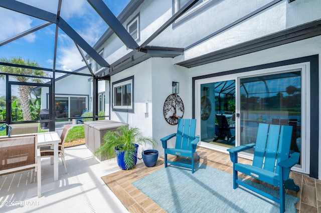 view of patio / terrace featuring a lanai