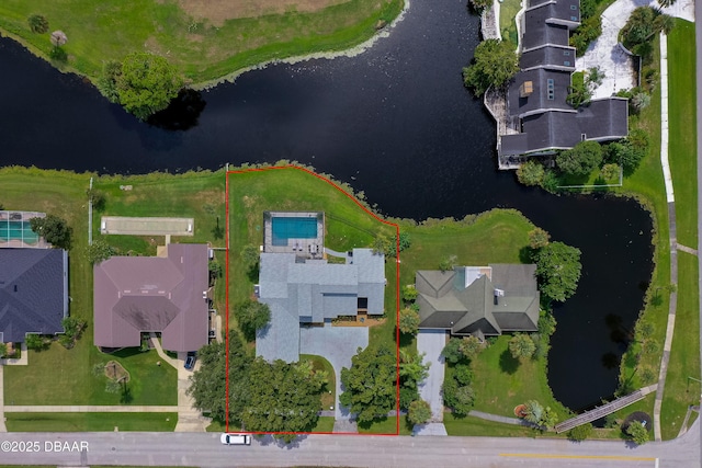 birds eye view of property with a water view