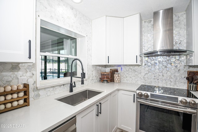 792 N Beach St, Ormond Beach, FL 32174 - kitchen featuring stainless steel electric range oven, wall chimney exhaust hood, backsplash, and white cabinetry