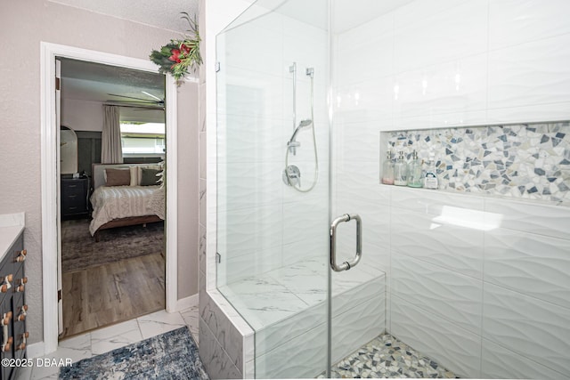 792 N Beach St, Ormond Beach, FL 32174 - bathroom with ensuite bath, a shower stall, vanity, marble look tile flooring, and a textured ceiling