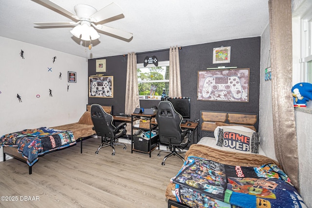 792 N Beach St, Ormond Beach, FL 32174 - bedroom with wood finished floors, an office area, and a ceiling fan