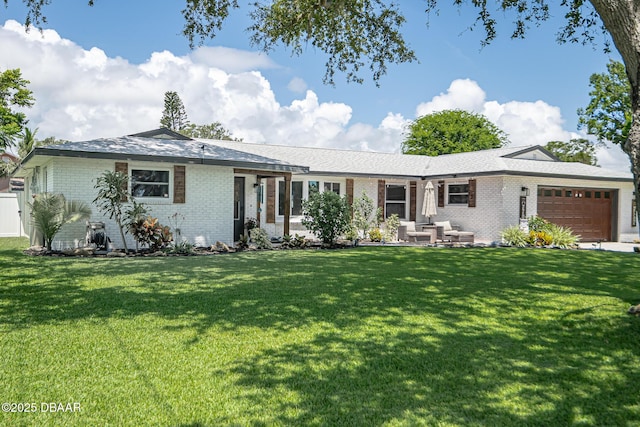 792 N Beach St, Ormond Beach, FL 32174 - ranch-style home featuring brick siding, an attached garage, and a front yard
