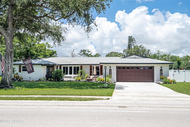 792 N Beach St, Ormond Beach, FL 32174 - ranch-style house featuring a garage, concrete driveway, and brick siding