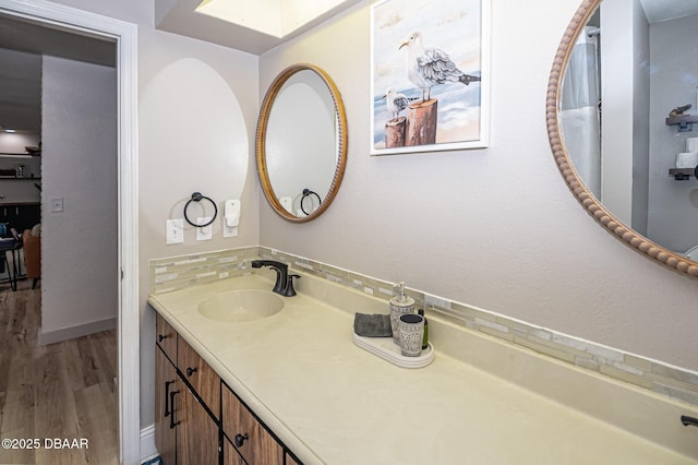 792 N Beach St, Ormond Beach, FL 32174 - full bath with wood finished floors, vanity, and a skylight