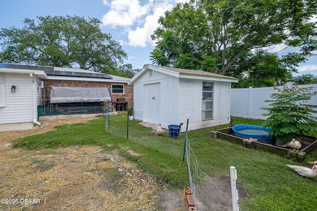 792 N Beach St, Ormond Beach, FL 32174 - view of shed with a vegetable garden and solar panels