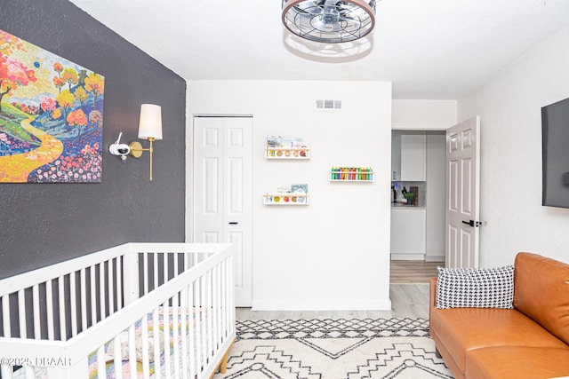 792 N Beach St, Ormond Beach, FL 32174 - bedroom featuring a closet and a crib