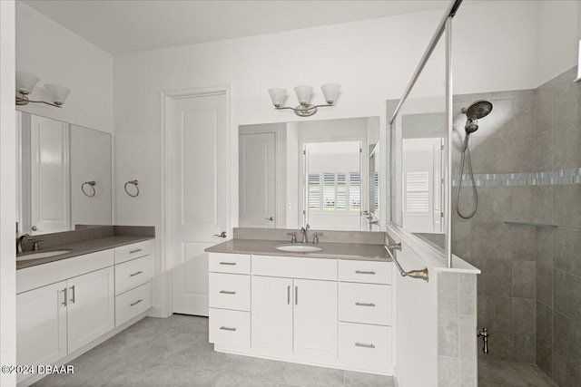 bathroom featuring vanity and a tile shower