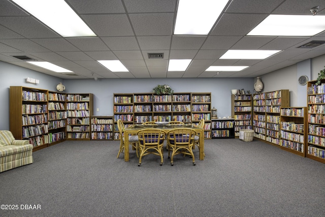 office area with carpet floors and a drop ceiling