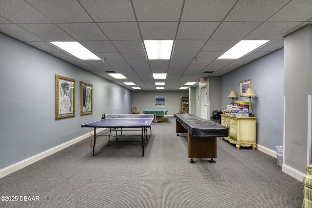 recreation room with a drop ceiling and carpet