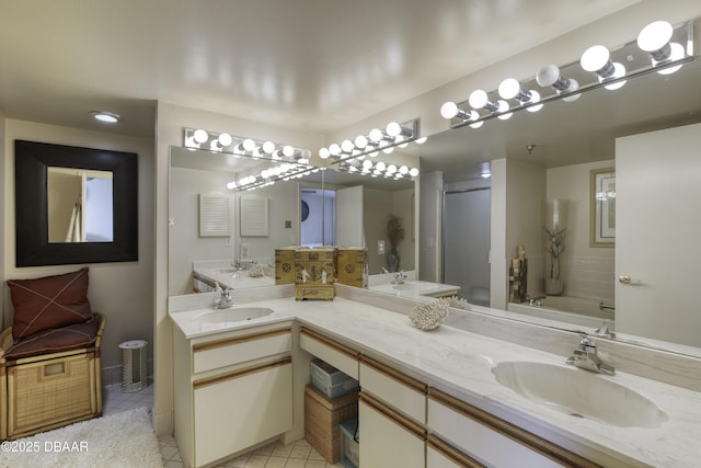 bathroom with tile patterned flooring, shower with separate bathtub, and vanity