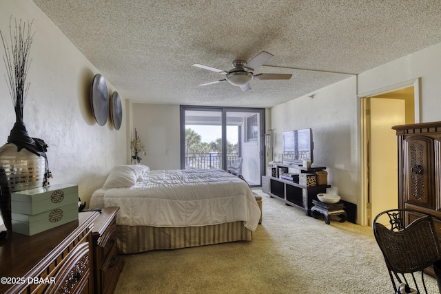 bedroom with carpet floors, ceiling fan, access to outside, and a textured ceiling