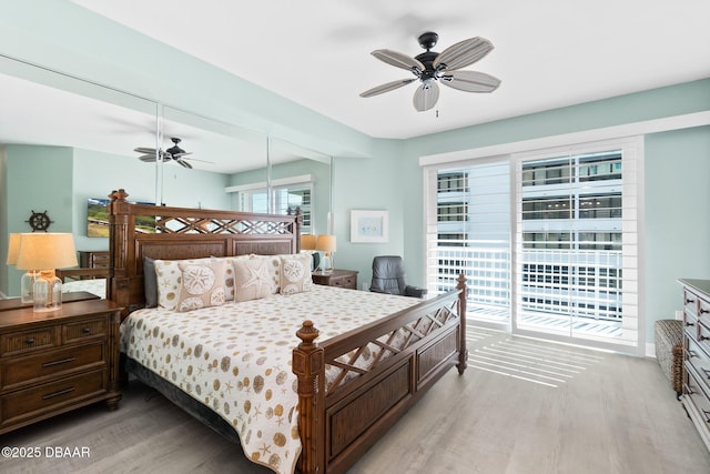 3737 S Atlantic Ave Unit 504, Daytona Beach Shores, FL 32118 - bedroom with light wood-type flooring, access to outside, and ceiling fan