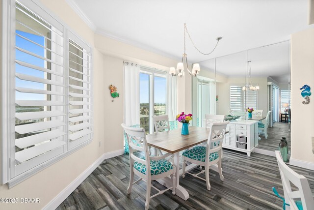 3737 S Atlantic Ave Unit 504, Daytona Beach Shores, FL 32118 - dining room featuring a chandelier, baseboards, dark wood-type flooring, and ornamental molding