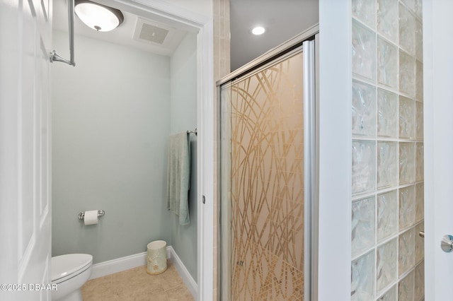 3737 S Atlantic Ave Unit 504, Daytona Beach Shores, FL 32118 - bathroom featuring a shower stall, toilet, tile patterned floors, and baseboards