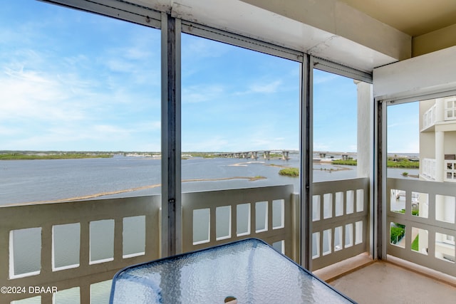 sunroom with a water view