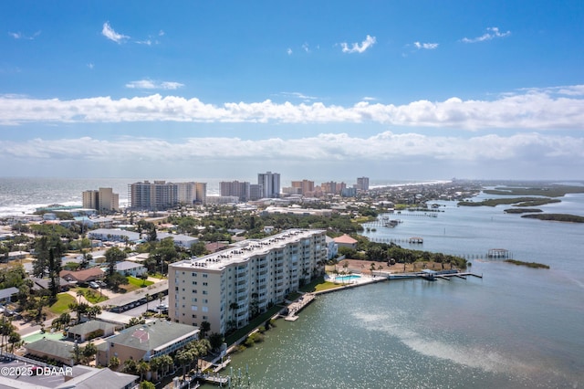 drone / aerial view featuring a water view and a city view