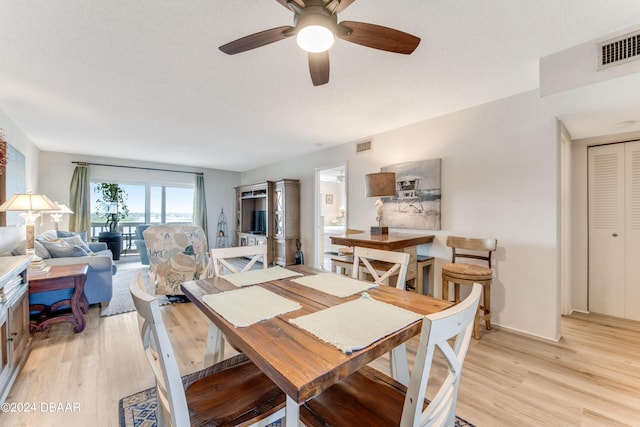 3606 S Peninsula Dr Unit 608, Port Orange, FL 32127 - dining space featuring light wood-style floors and a ceiling fan