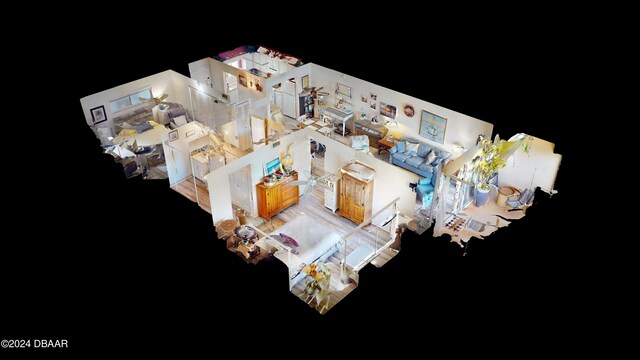 kitchen with hanging light fixtures, white appliances, white cabinetry, and light hardwood / wood-style flooring