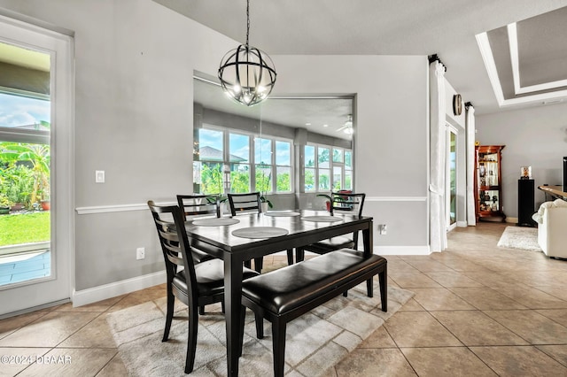 dining space with a chandelier, light tile patterned floors, and plenty of natural light