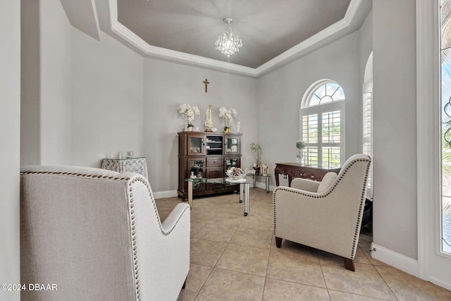 interior space with a notable chandelier, light tile patterned floors, and a raised ceiling