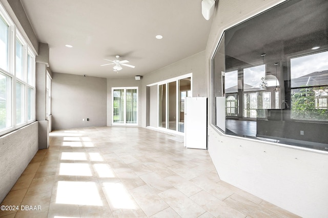 interior space featuring a wealth of natural light and ceiling fan