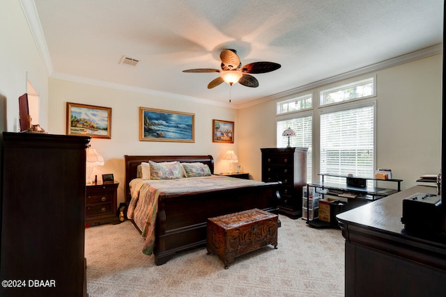 carpeted bedroom with ornamental molding, a textured ceiling, and ceiling fan