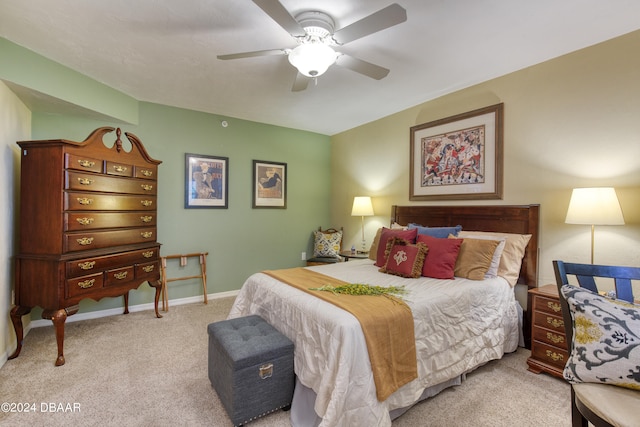 bedroom with light colored carpet and ceiling fan