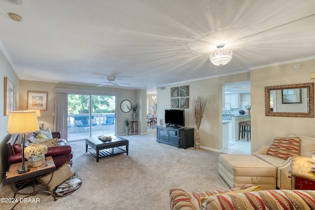 carpeted living room featuring ornamental molding and ceiling fan