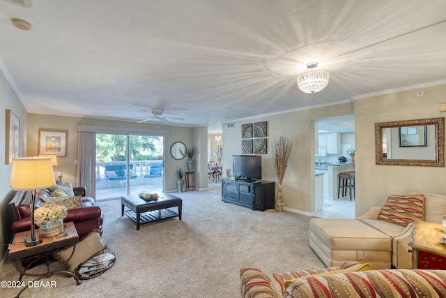 living room with ceiling fan, light carpet, and ornamental molding