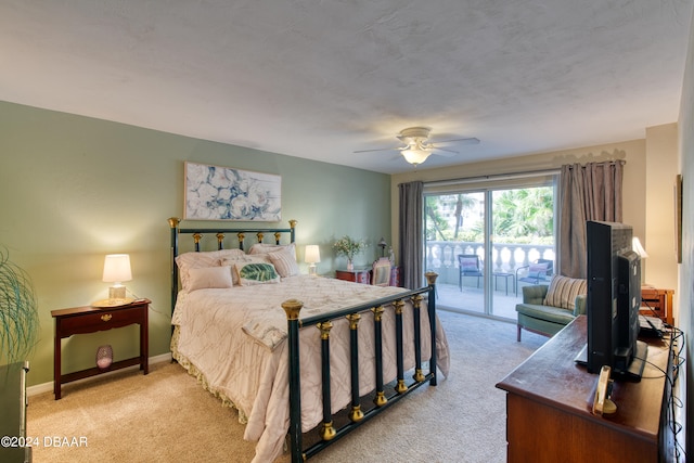 bedroom with access to outside, ceiling fan, and light colored carpet