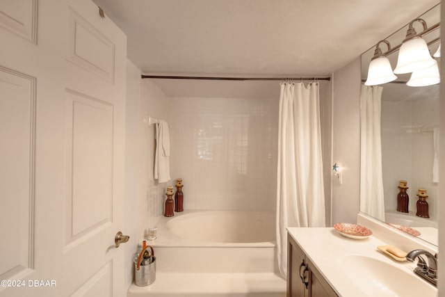 bathroom featuring vanity and shower / tub combo with curtain