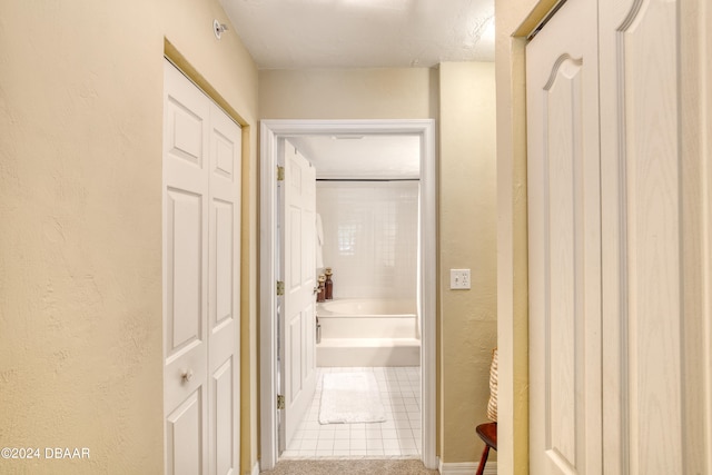 hallway featuring tile patterned floors