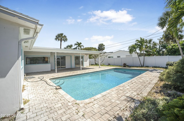 view of pool featuring a fenced backyard, a fenced in pool, and a patio