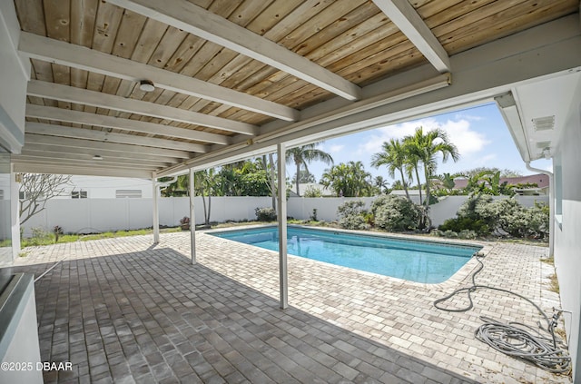 view of swimming pool featuring a fenced in pool, a patio, and a fenced backyard