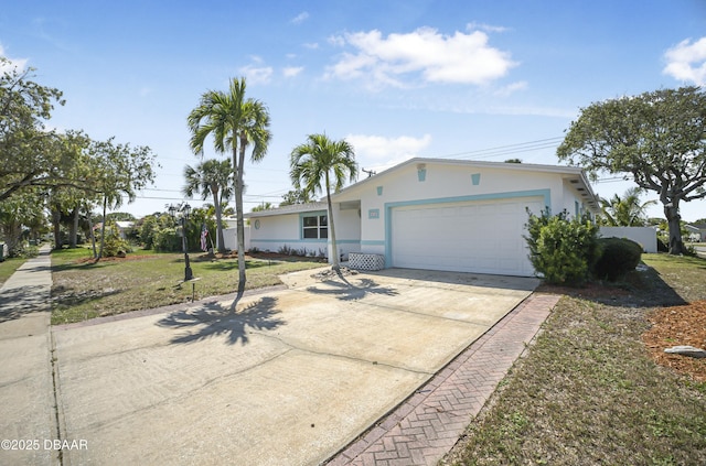 ranch-style house with stucco siding, driveway, a front lawn, and an attached garage