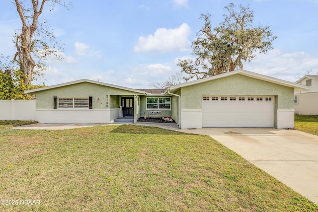 ranch-style house featuring a front lawn and a garage