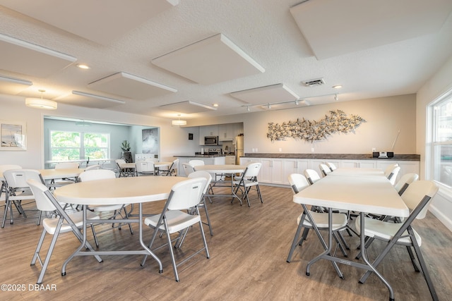 325 N Causeway Cswy Unit B305, New Smyrna Beach, FL 32169 - dining space featuring light wood-style flooring and recessed lighting