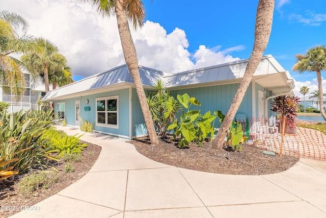 325 N Causeway Cswy Unit B305, New Smyrna Beach, FL 32169 - view of front facade with a metal roof