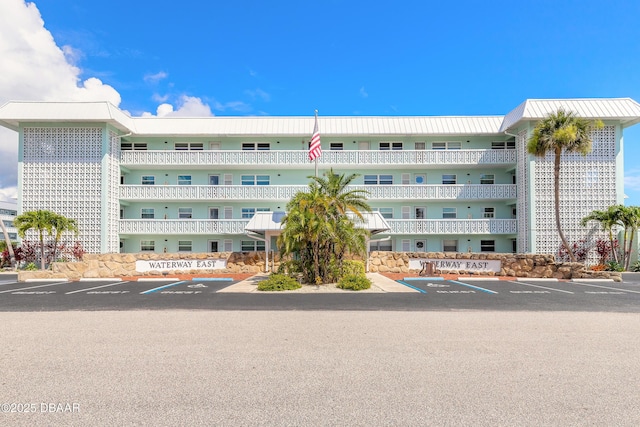 325 N Causeway Cswy Unit B305, New Smyrna Beach, FL 32169 - view of building exterior featuring uncovered parking