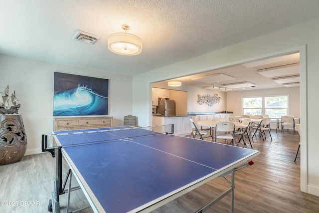 325 N Causeway Cswy Unit B305, New Smyrna Beach, FL 32169 - rec room with light wood-style flooring