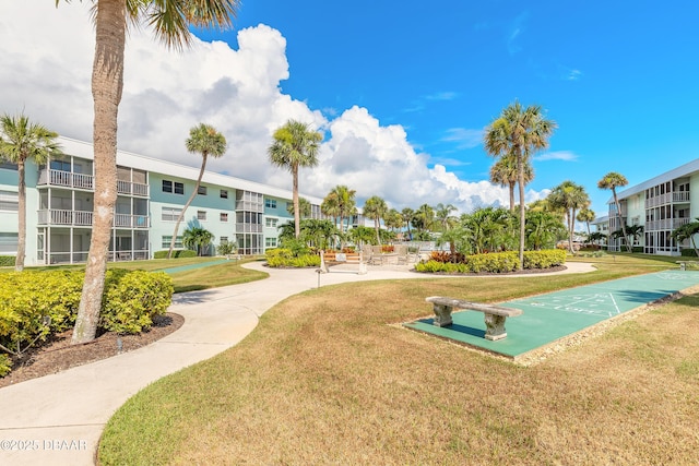 325 N Causeway Cswy Unit B305, New Smyrna Beach, FL 32169 - view of property's community with shuffleboard and a yard