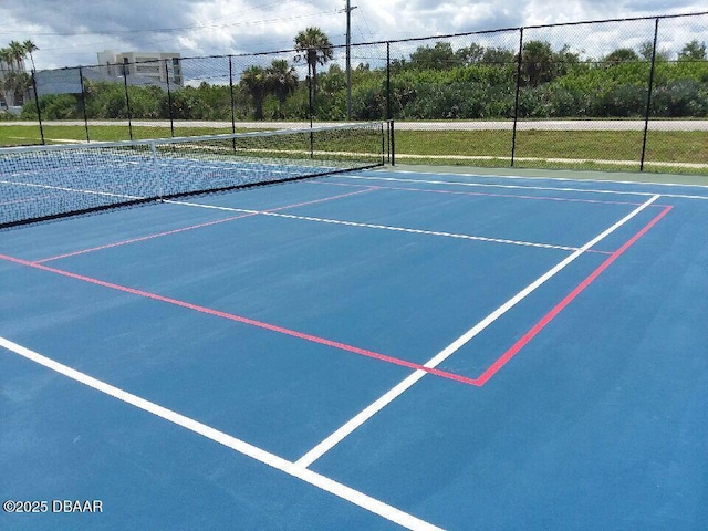 4849 Saxon Dr Unit C202, New Smyrna Beach, FL 32169 - view of tennis court featuring community basketball court