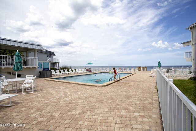 4849 Saxon Dr Unit C202, New Smyrna Beach, FL 32169 - community pool featuring a patio area and a water view