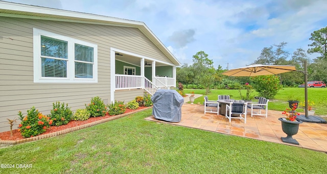 view of yard featuring a patio and a fire pit