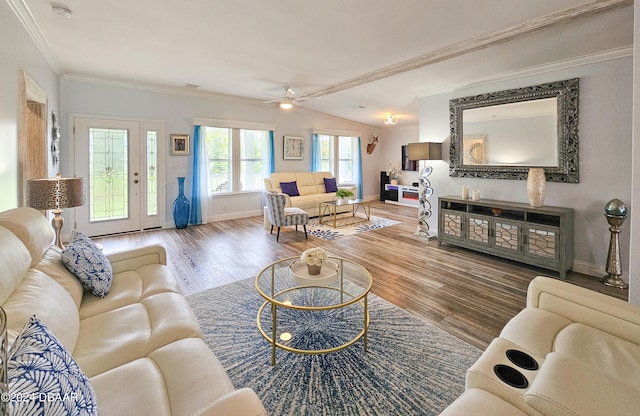 living room featuring wood-type flooring, vaulted ceiling, ceiling fan, and crown molding