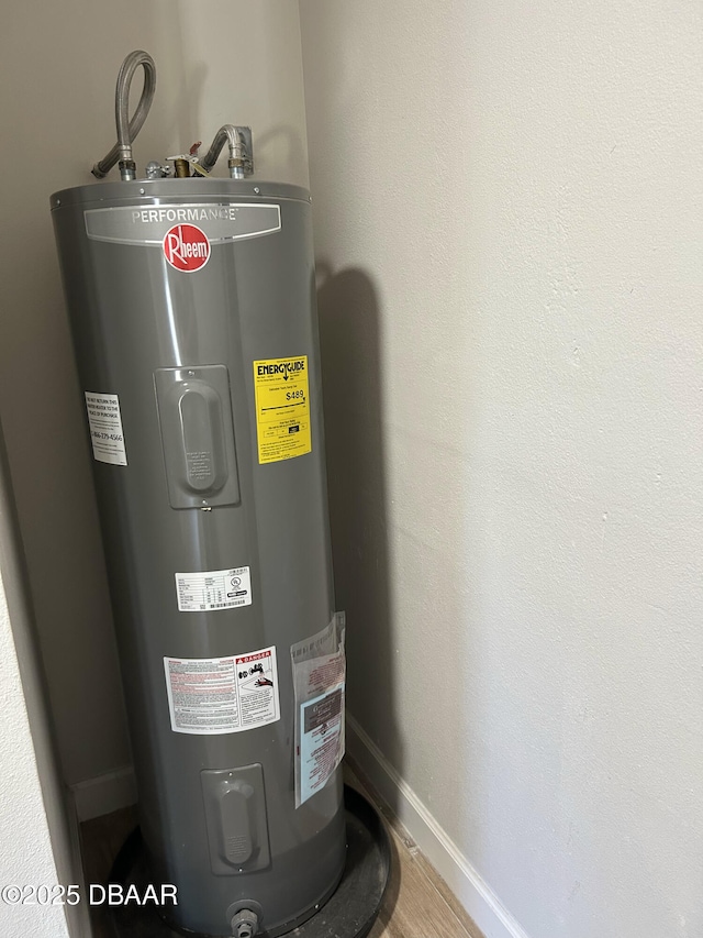 utility room featuring electric water heater