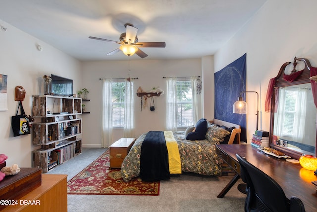 carpeted bedroom with ceiling fan