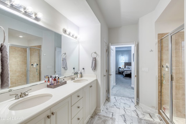 bathroom with vanity and an enclosed shower