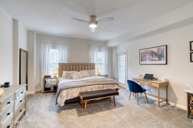 bedroom featuring light colored carpet and ceiling fan