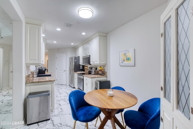 dining area featuring sink